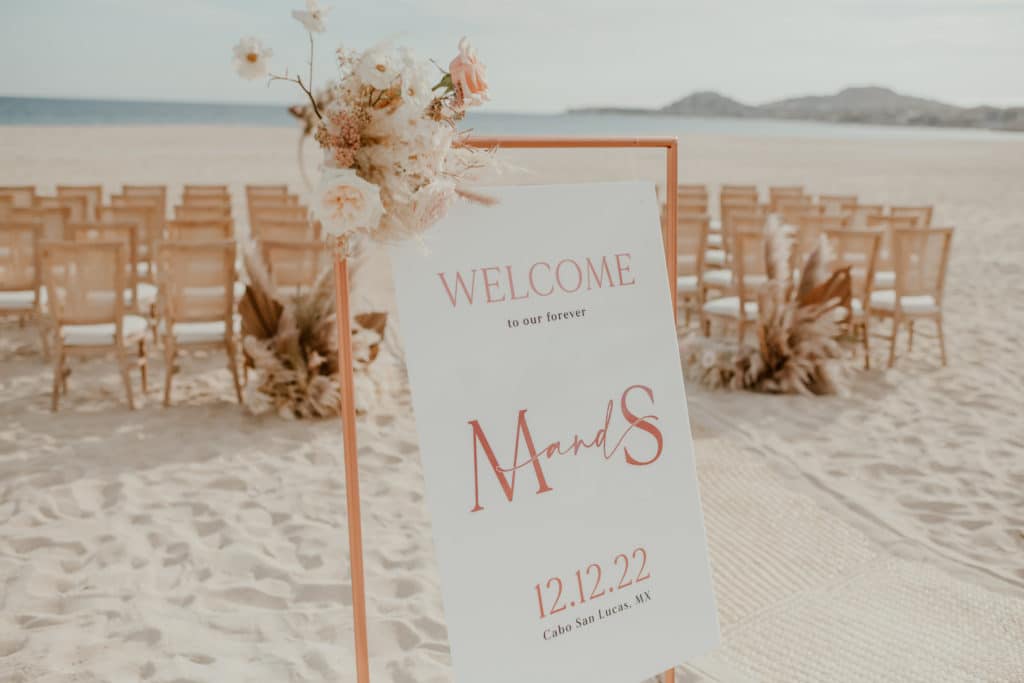 Welcome sign beach ceremony los cabos