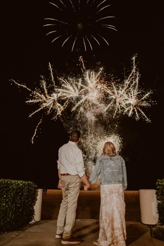 Beach wedding fireworks in los cabos