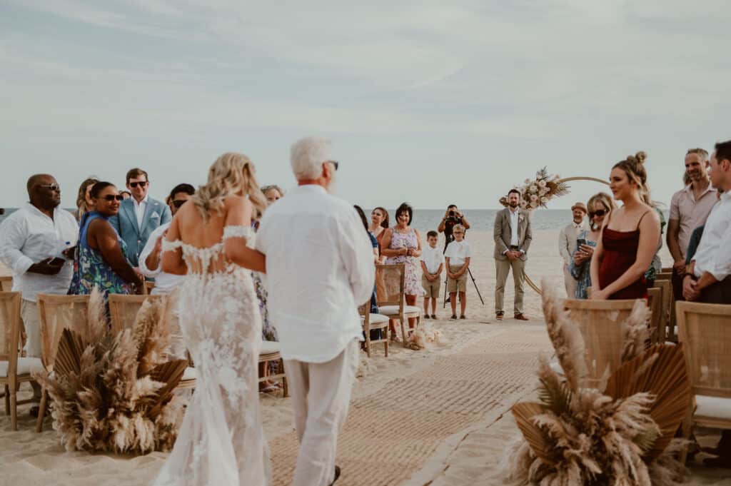 Walking down the aisle to your beach wedding ceremony