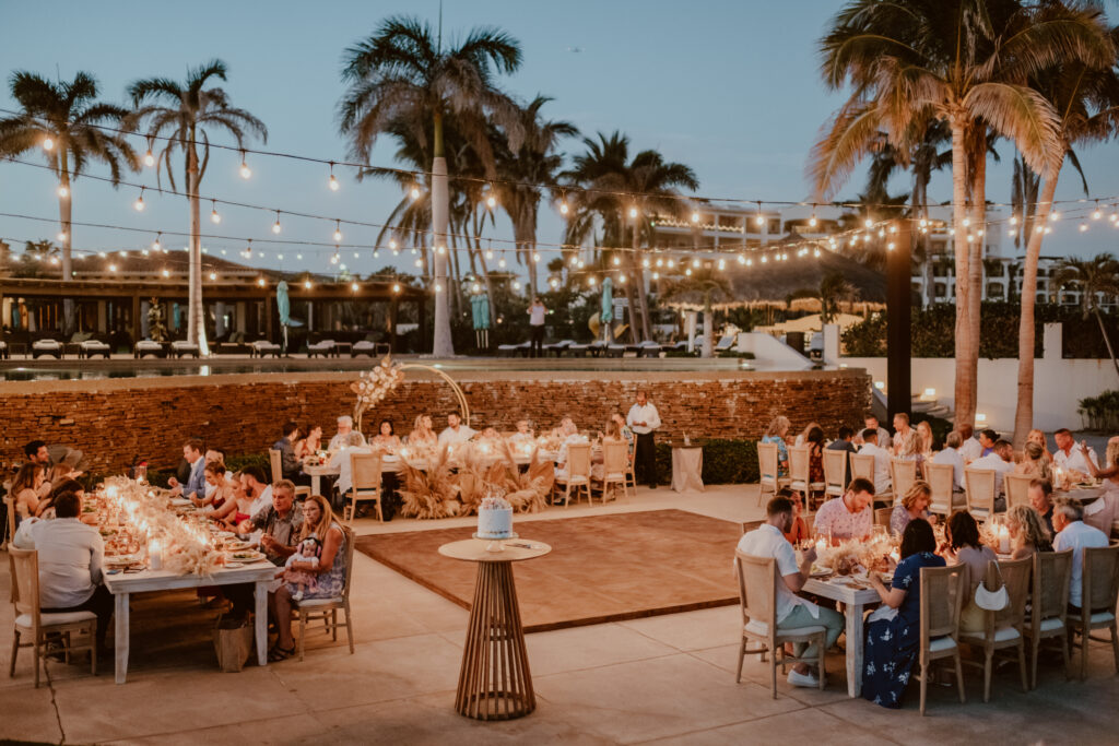 Cabo wedding reception on an ocean view terrace. Neutral wood and beige colors.